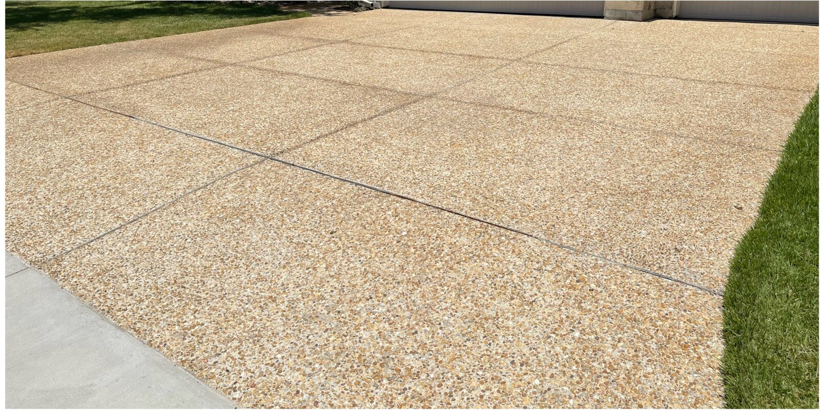 After: pressure-washed driveway