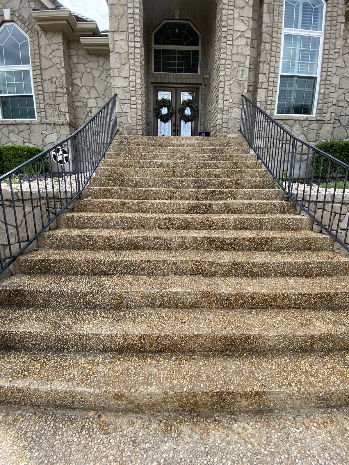 Before: dirty exposed-aggregate stairs at a San Antonio home